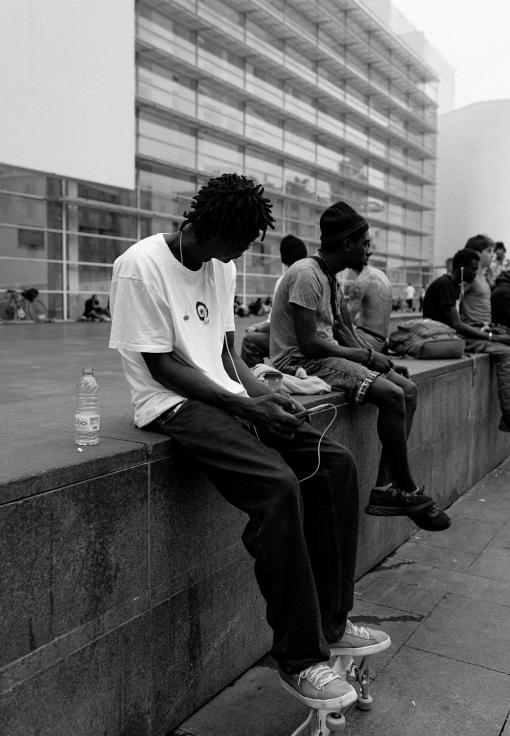 a group of people sit on a bench