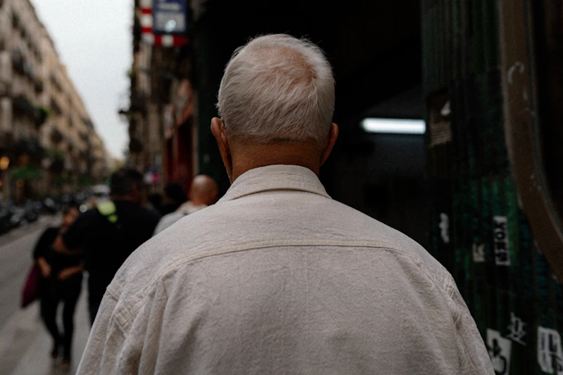 reflective older gentleman looking ahead