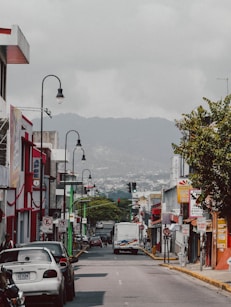 a street with cars and buildings on the side