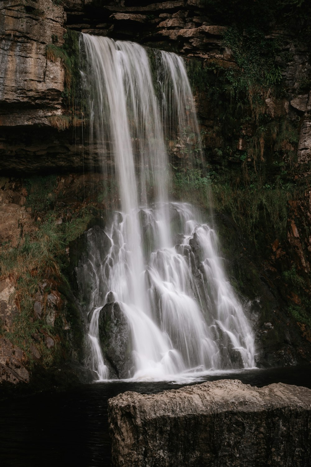 a waterfall in a rocky area