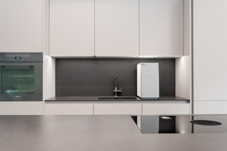 a kitchen with white cabinets