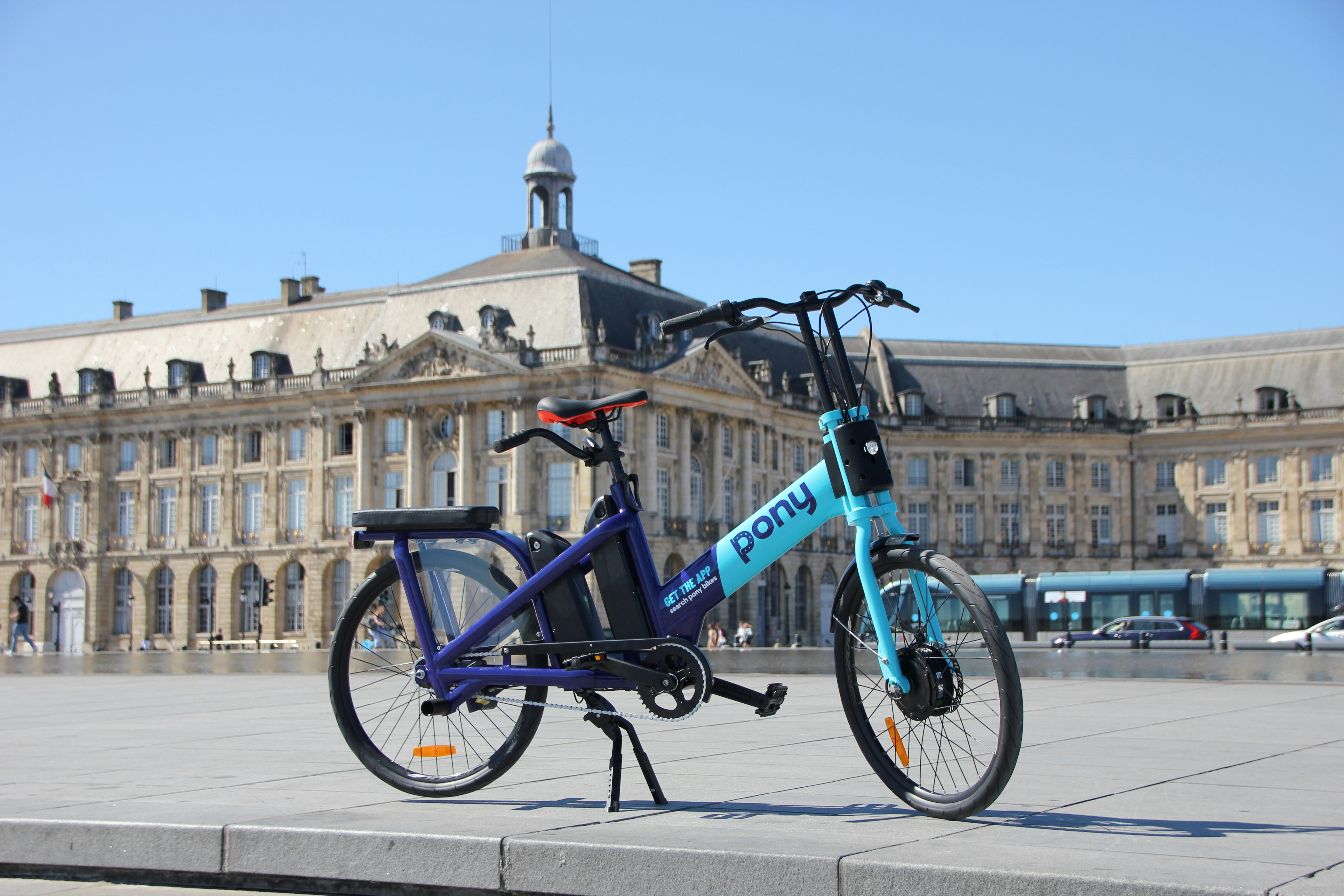 a bicycle parked on a sidewalk
