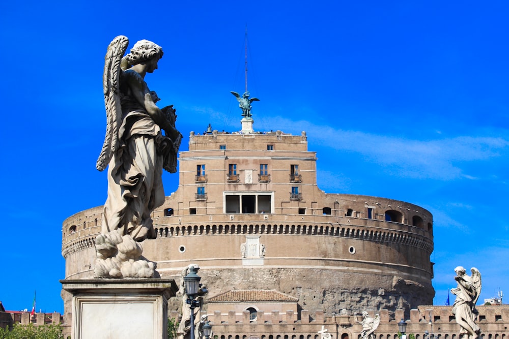 a statue in front of Castel Sant'Angelo