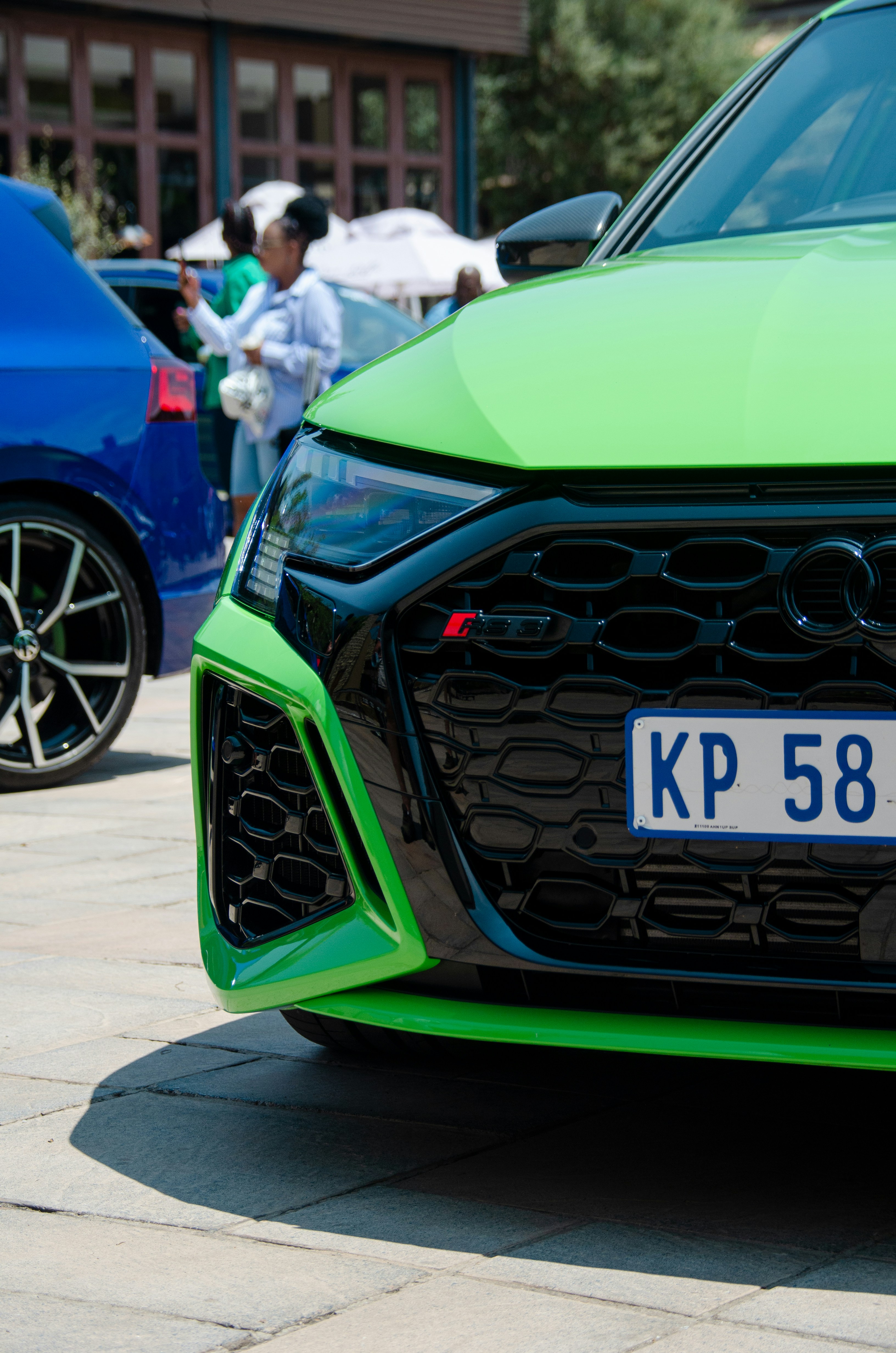 a car with a green hood