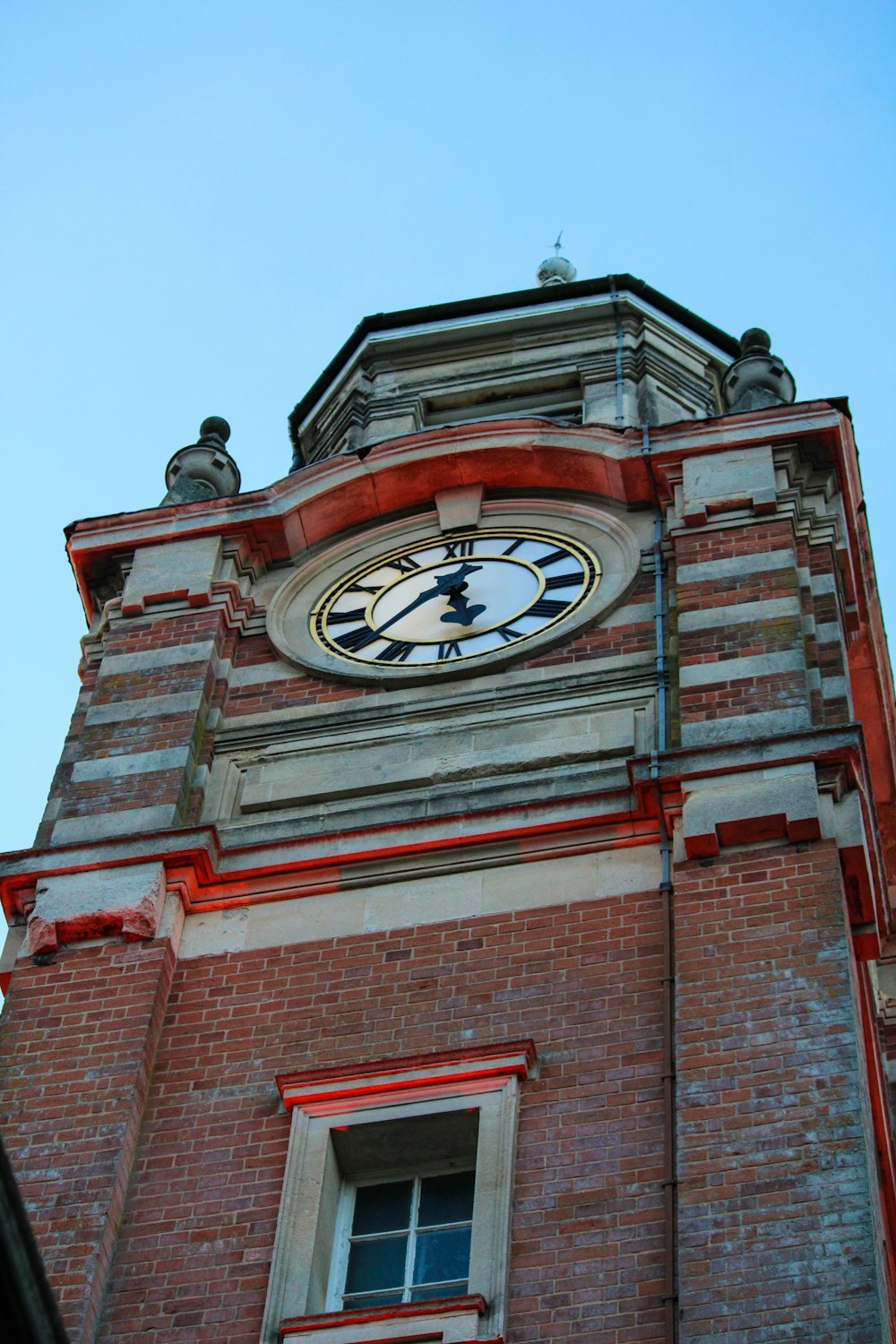 a clock on a brick building