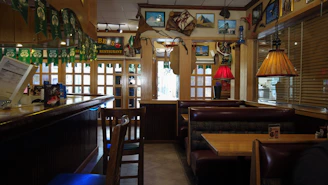 Cozy seafood restaurant interior with rustic decor and wooden tables.
