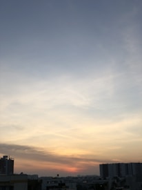 Sunset view over Concordia city skyline with soft glowing lights.
