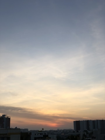 Sunset view over Concordia city skyline with soft glowing lights.