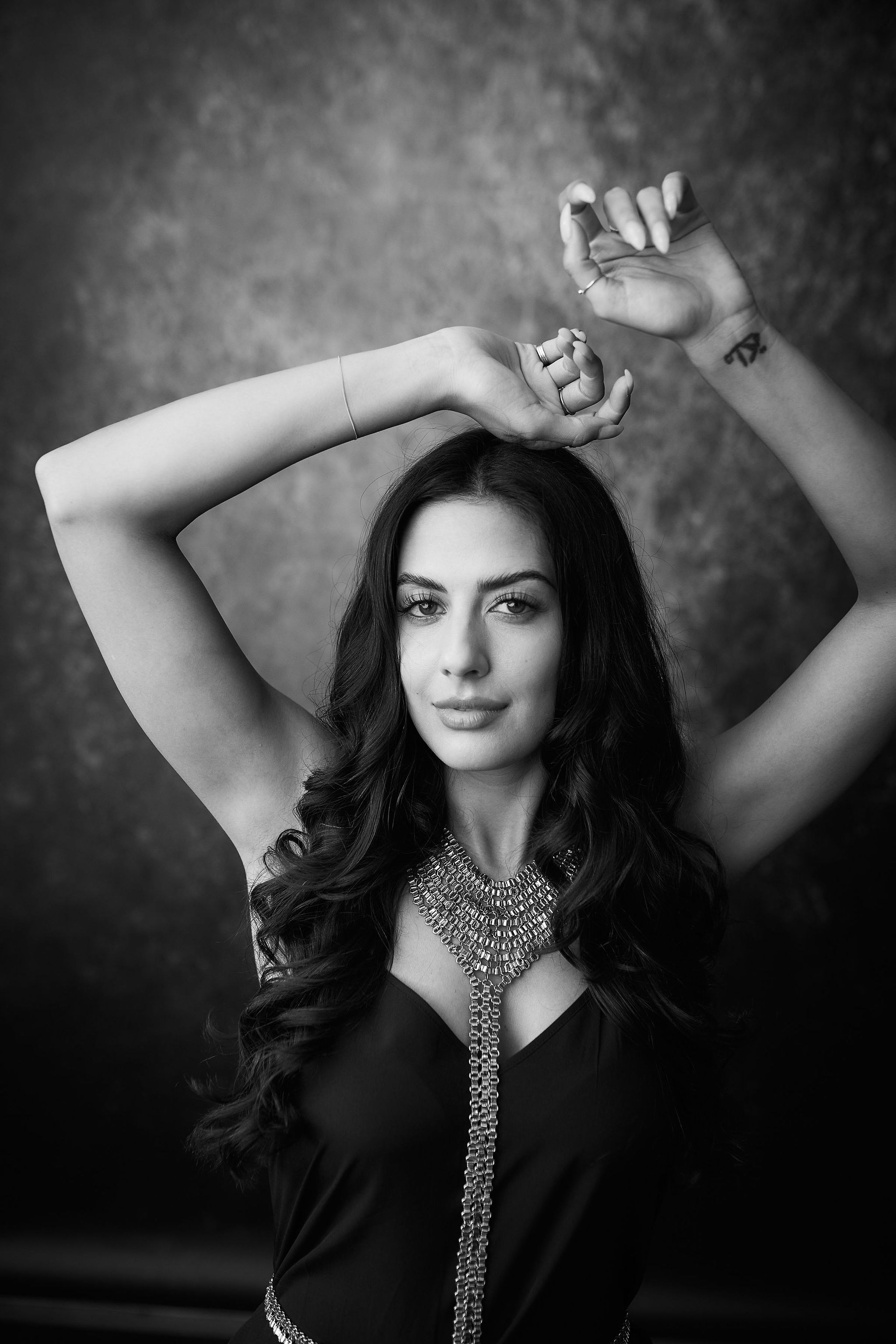 a woman with her hands up