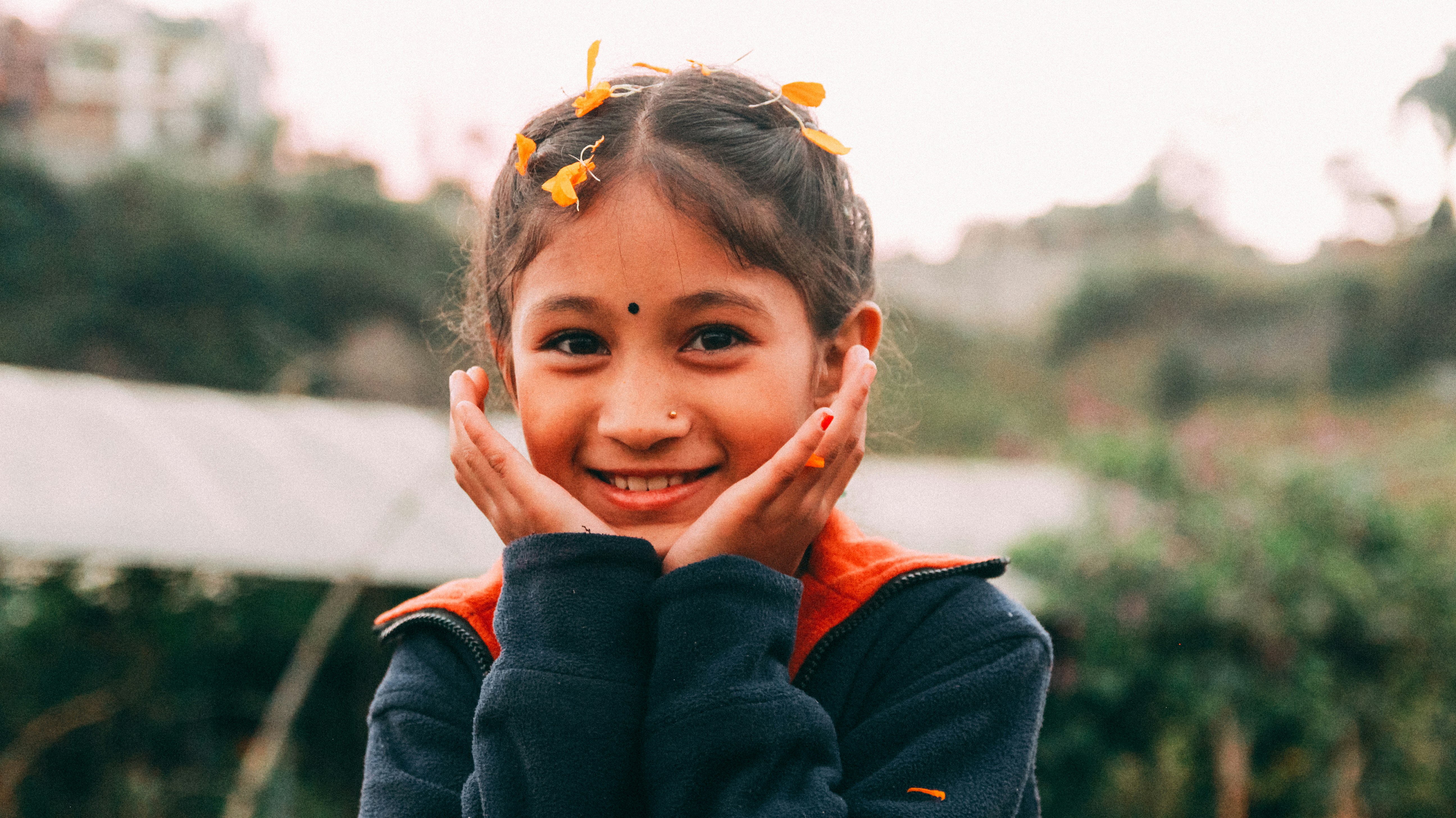 a girl with her hands on her face