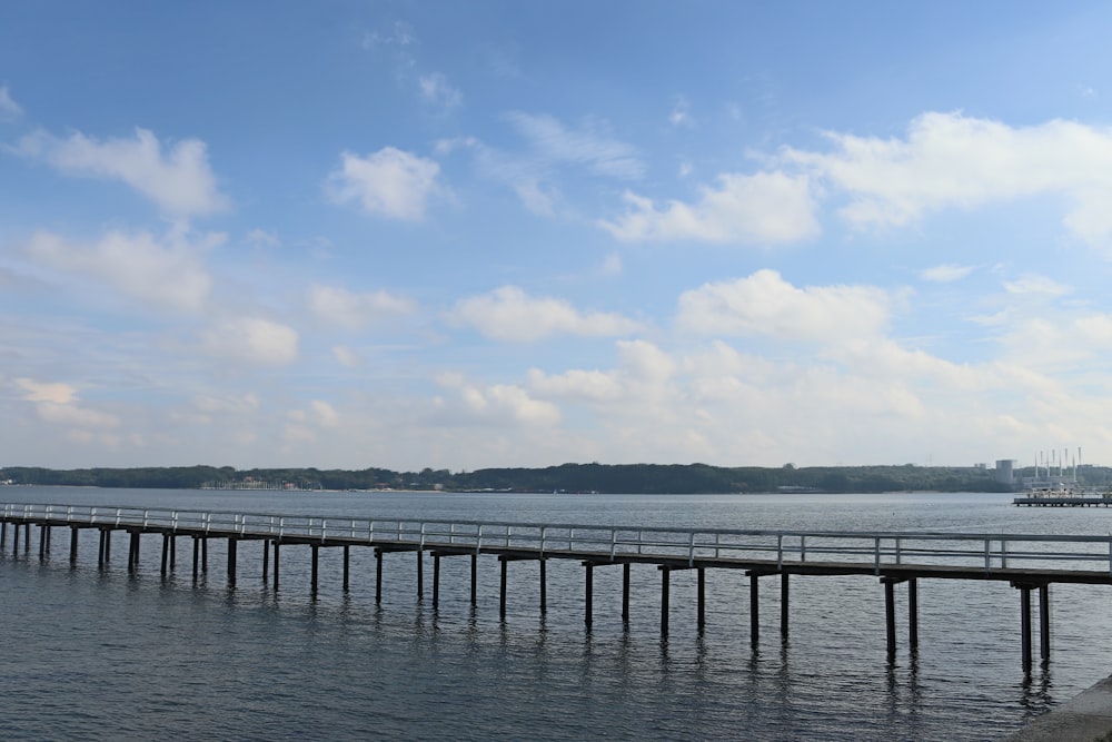 a body of water with a dock and a boat in it