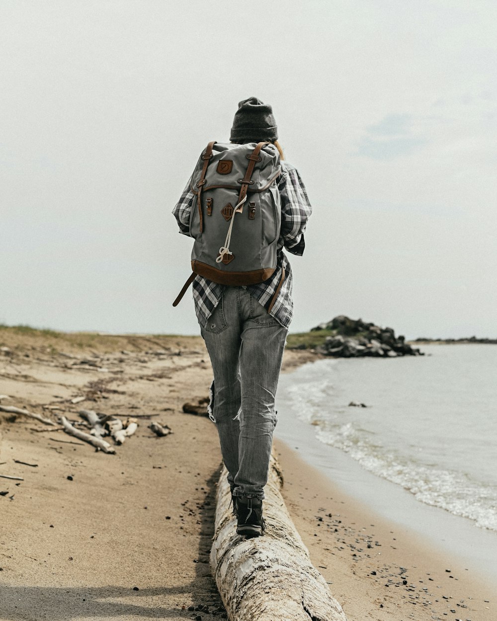 a person walking on a beach