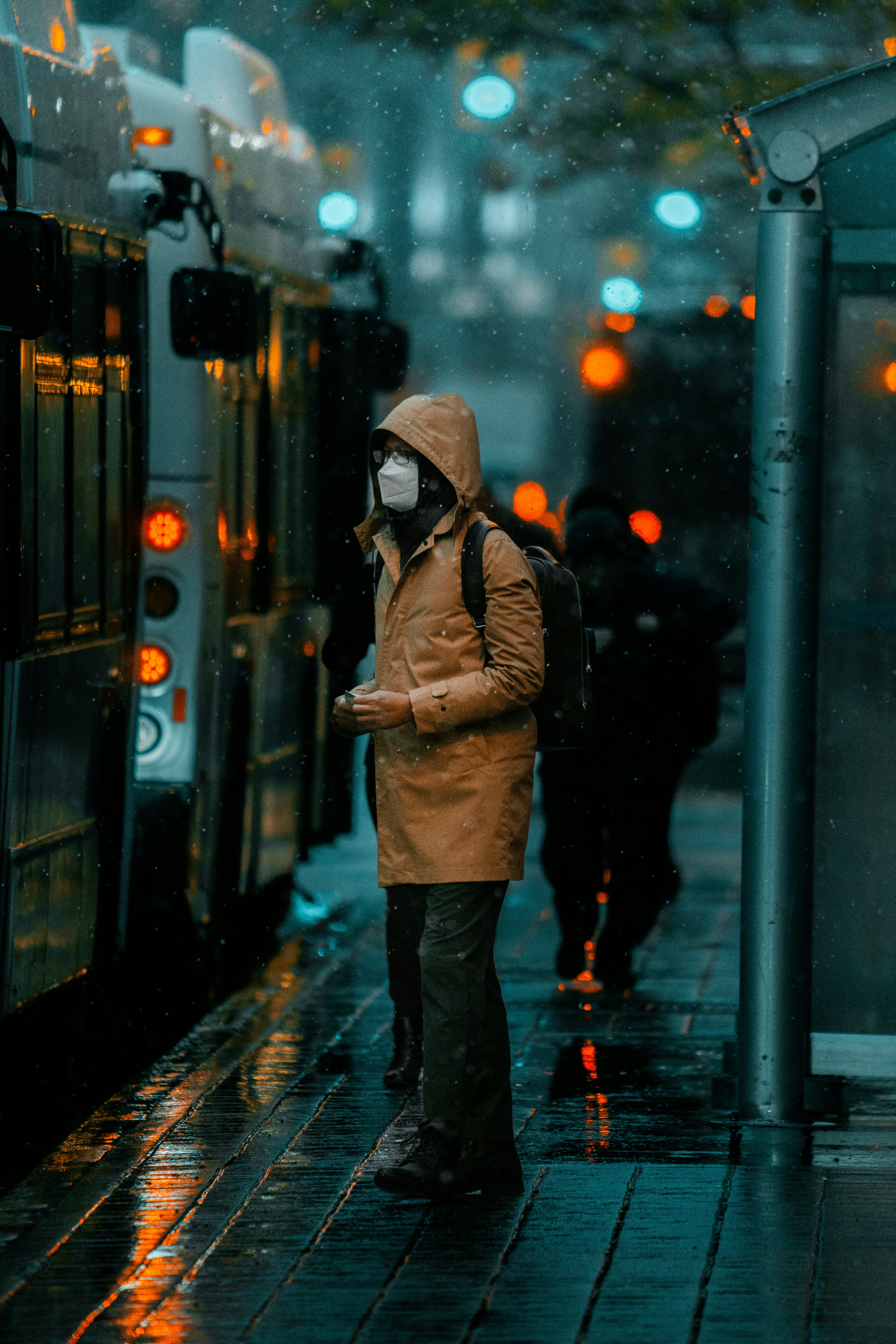 a person standing next to a train