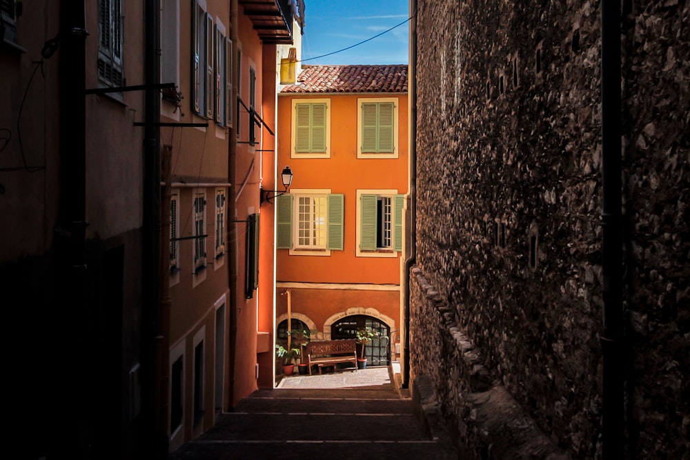 a narrow alley between two buildings