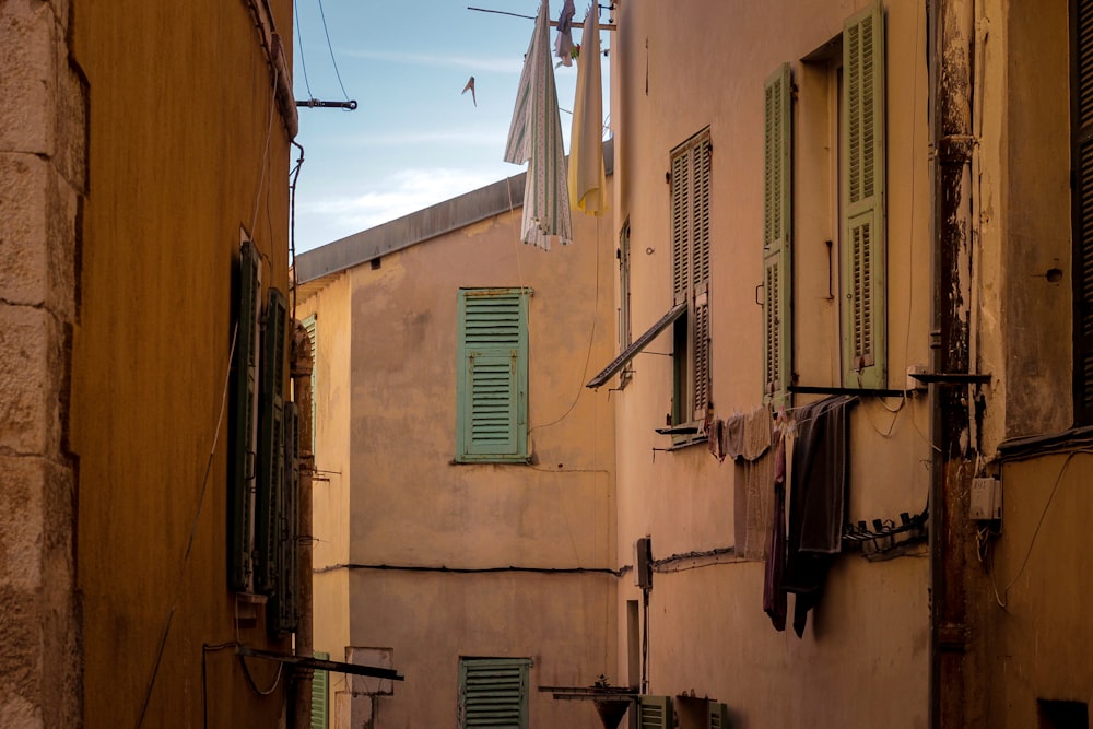 a row of buildings with clothes