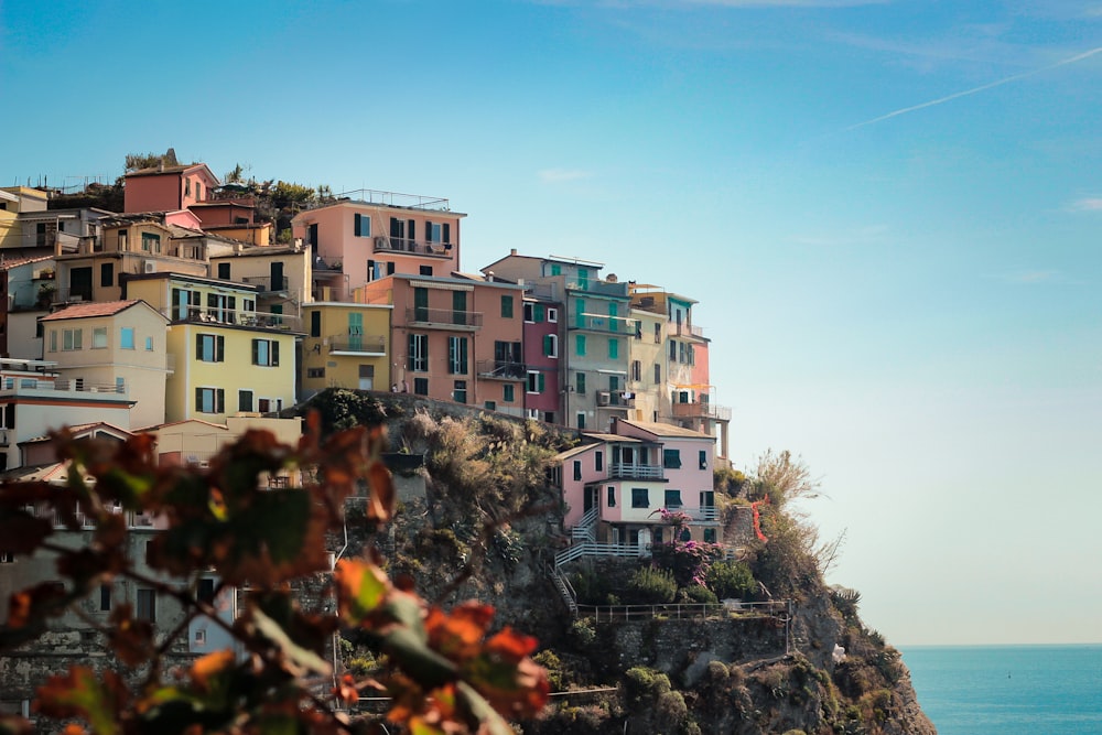 a group of buildings by the water