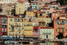 a group of colorful buildings next to a body of water
