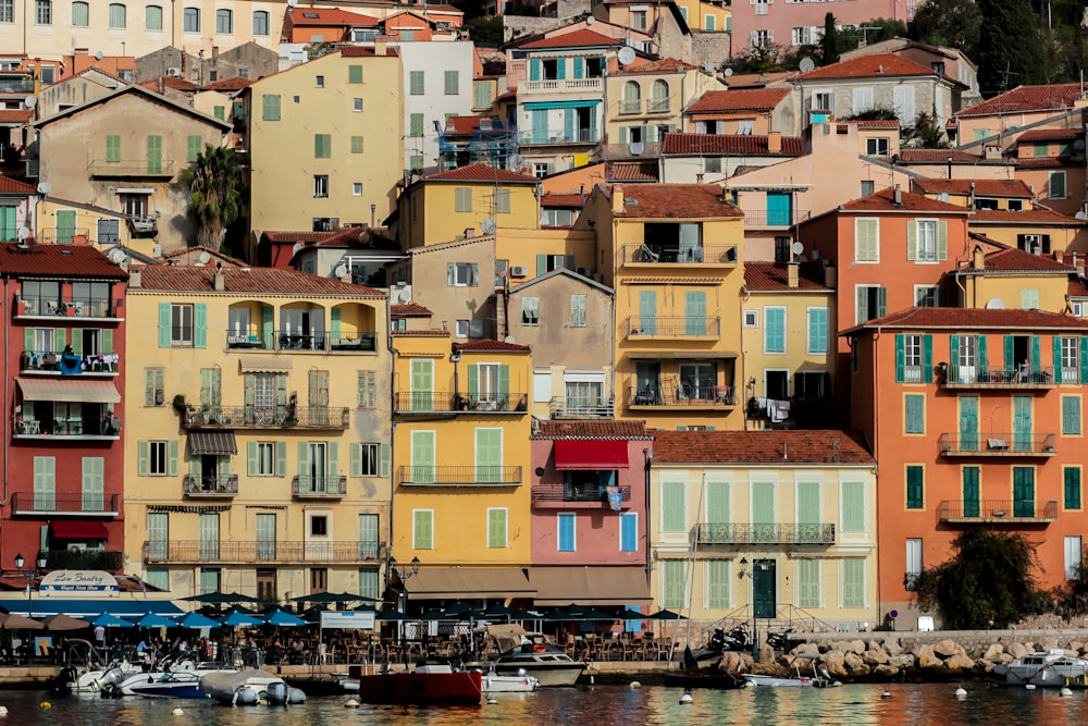 a group of colorful buildings next to a body of water