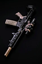 a black and silver rifle