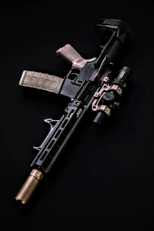 a black and silver rifle