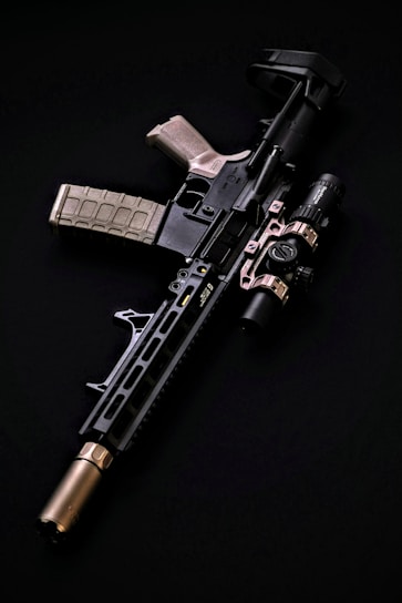 a black and silver rifle