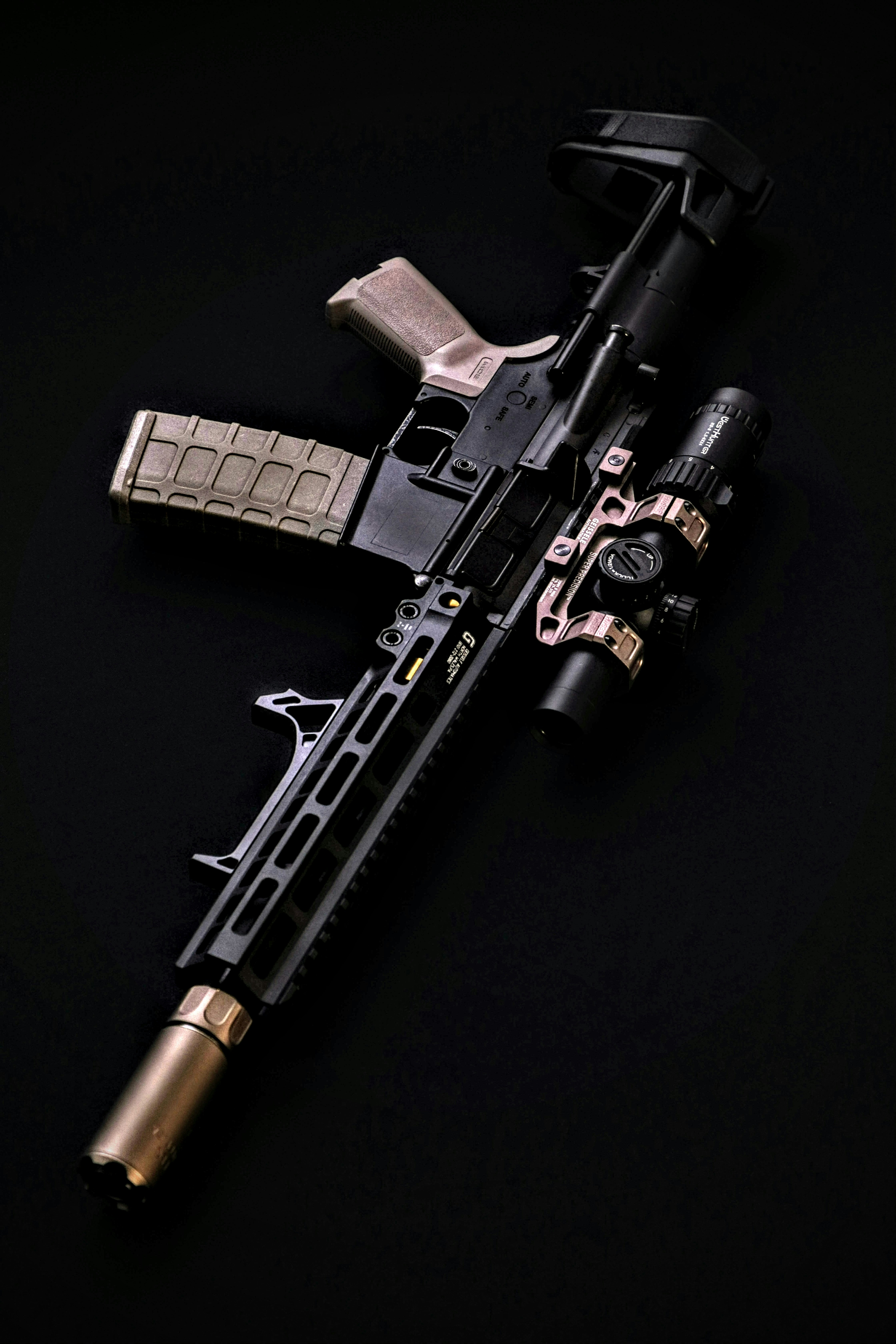 a black and silver rifle