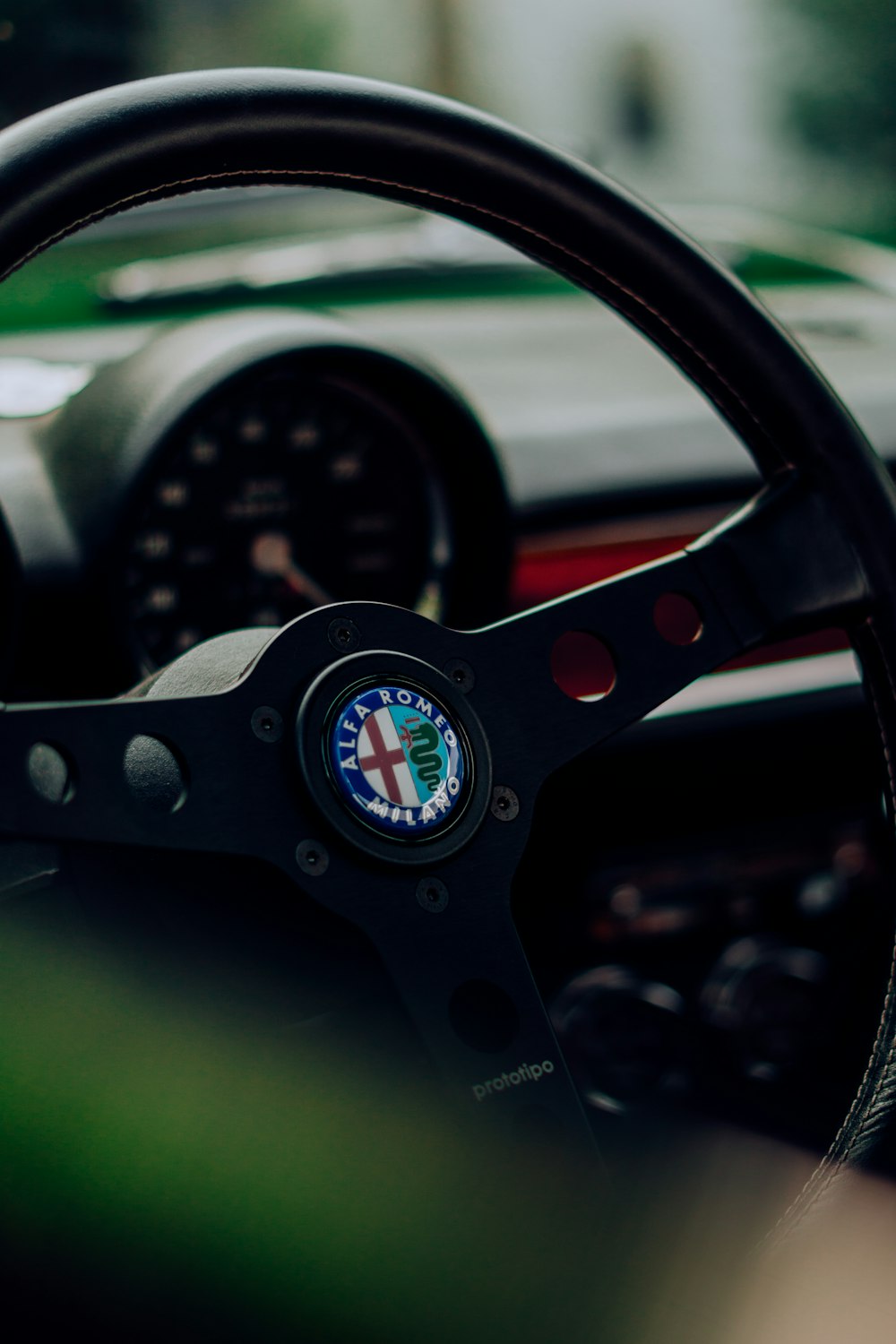 a steering wheel and dashboard of a car