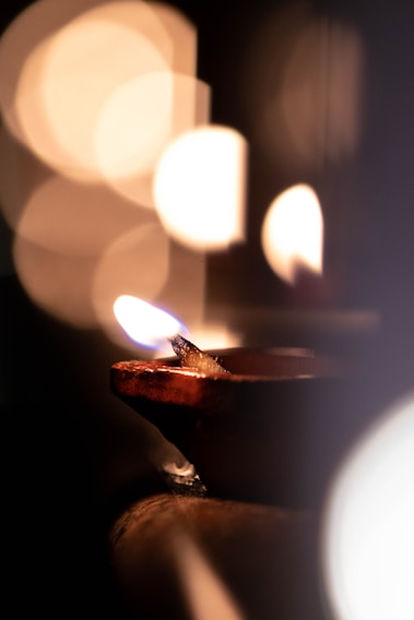 A serene close-up of a beautifully detailed kundli chart illuminated by soft candlelight, evoking a sense of spiritual depth.