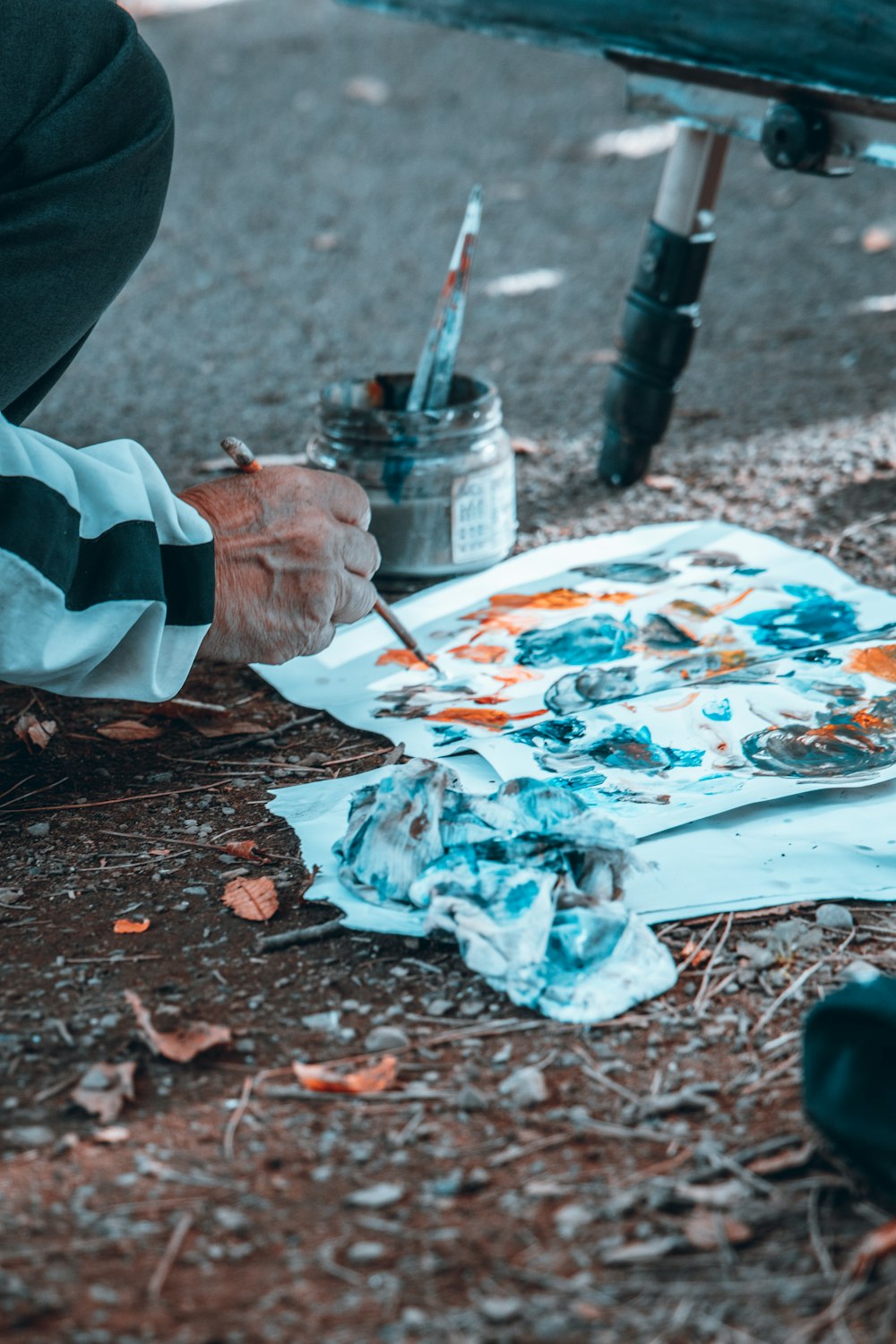 a person painting on the ground