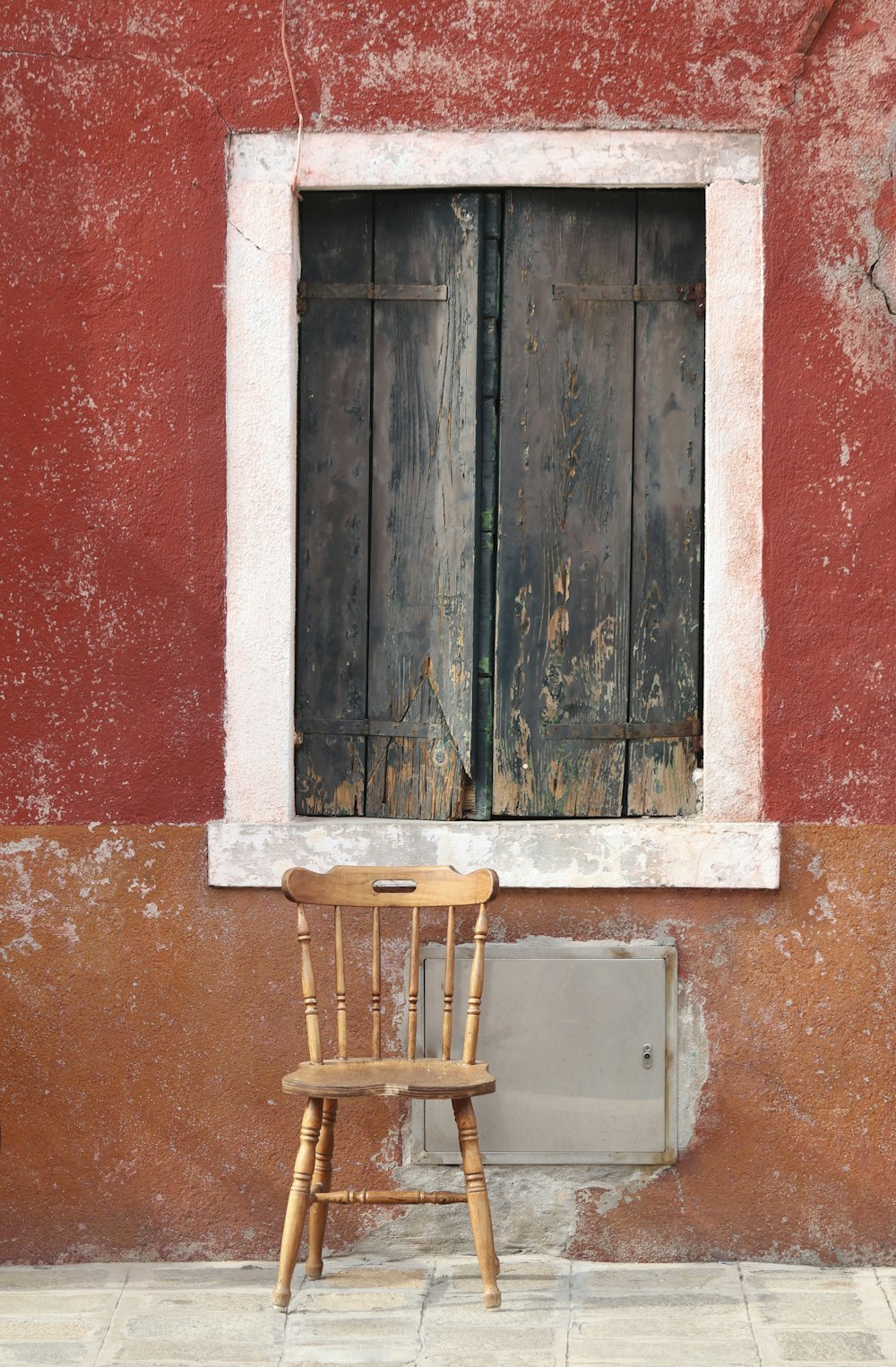 a chair sits in front of a window
