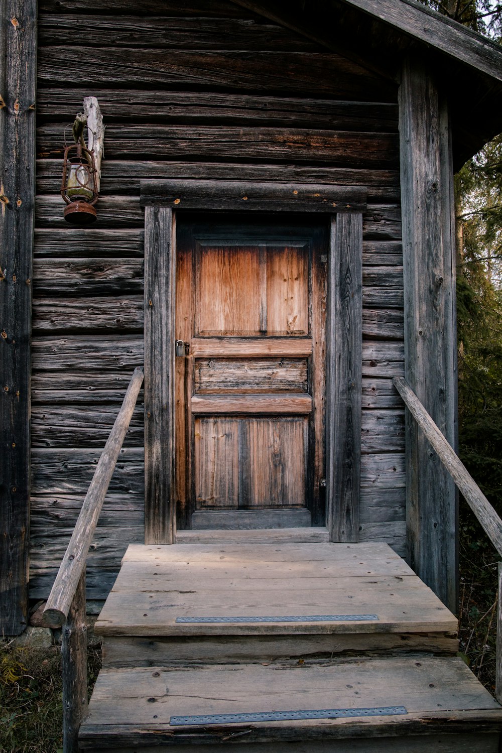 a wooden door in a wooden cabin