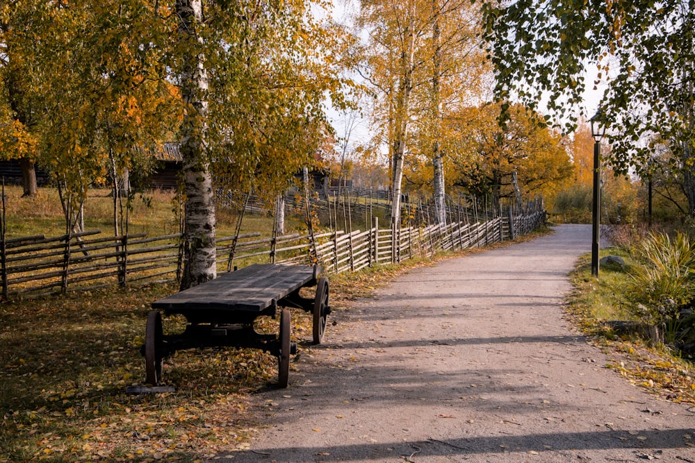 a wooden bench on a path
