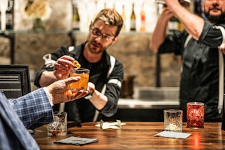 a man holding a glass of beer