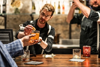 a man holding a glass of beer