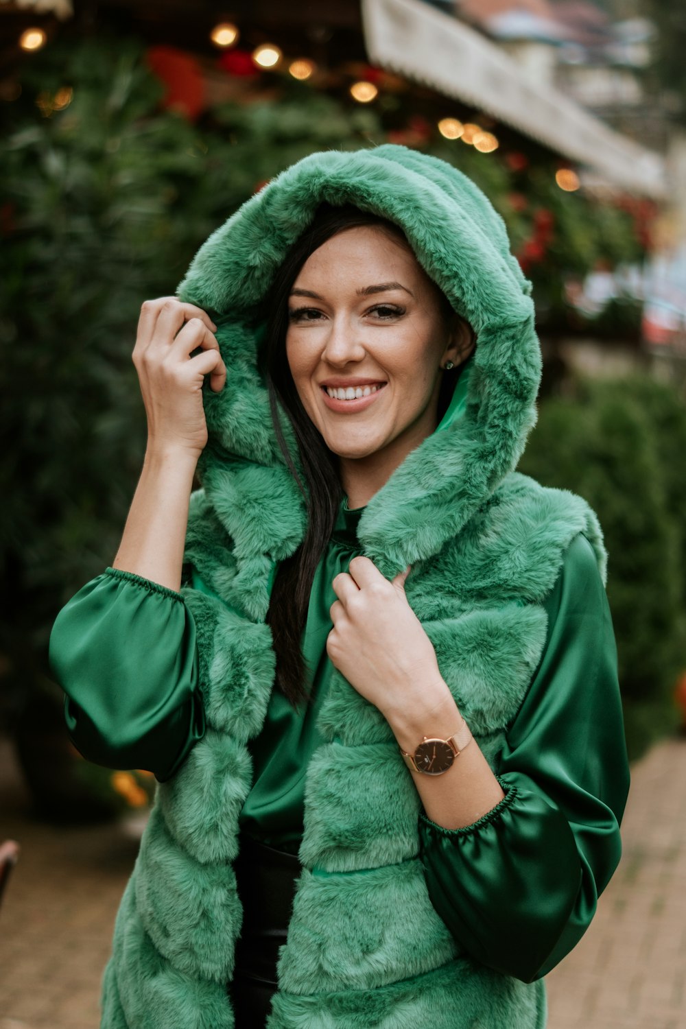 a person wearing a green head scarf