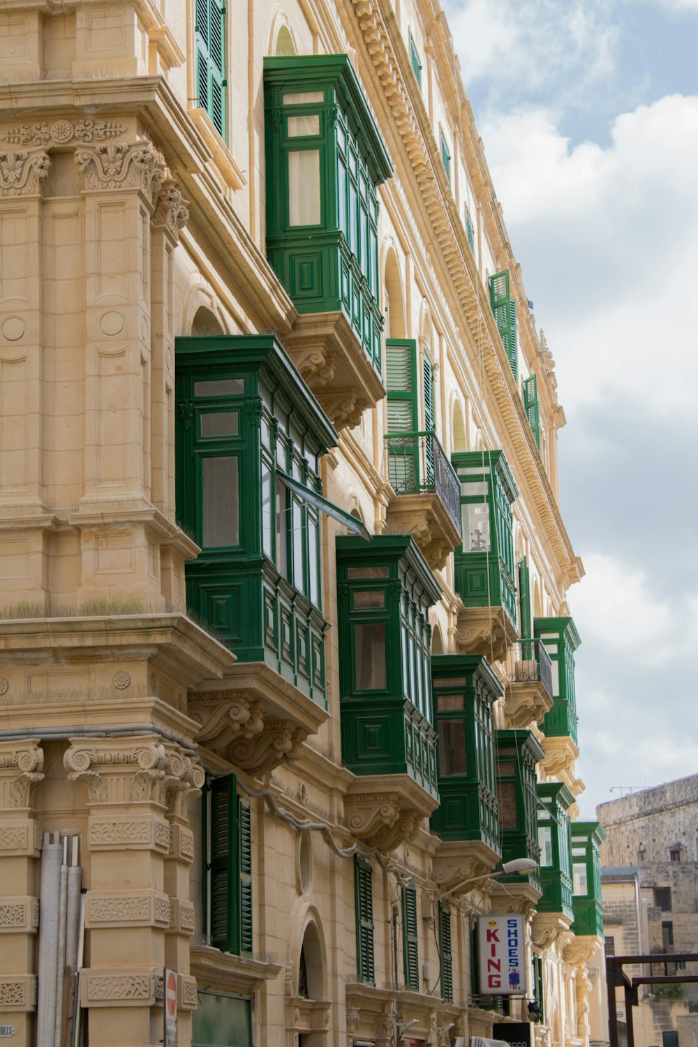 a building with green shutters