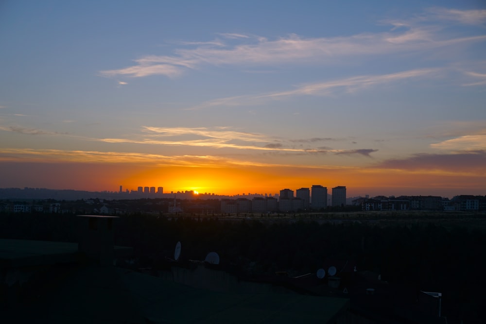 a city skyline at sunset