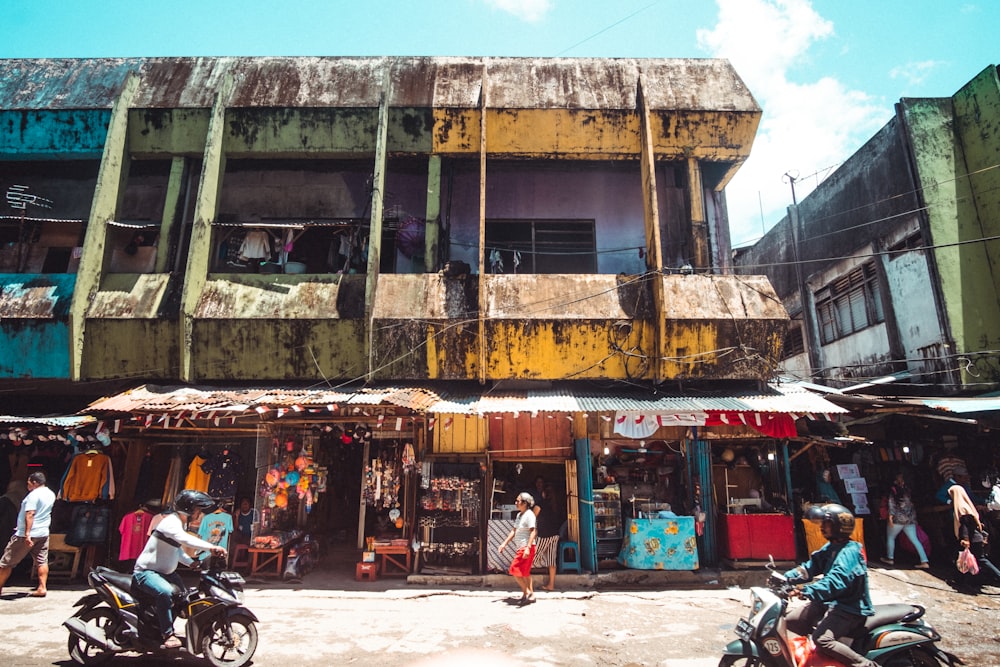 a group of people walking by a building