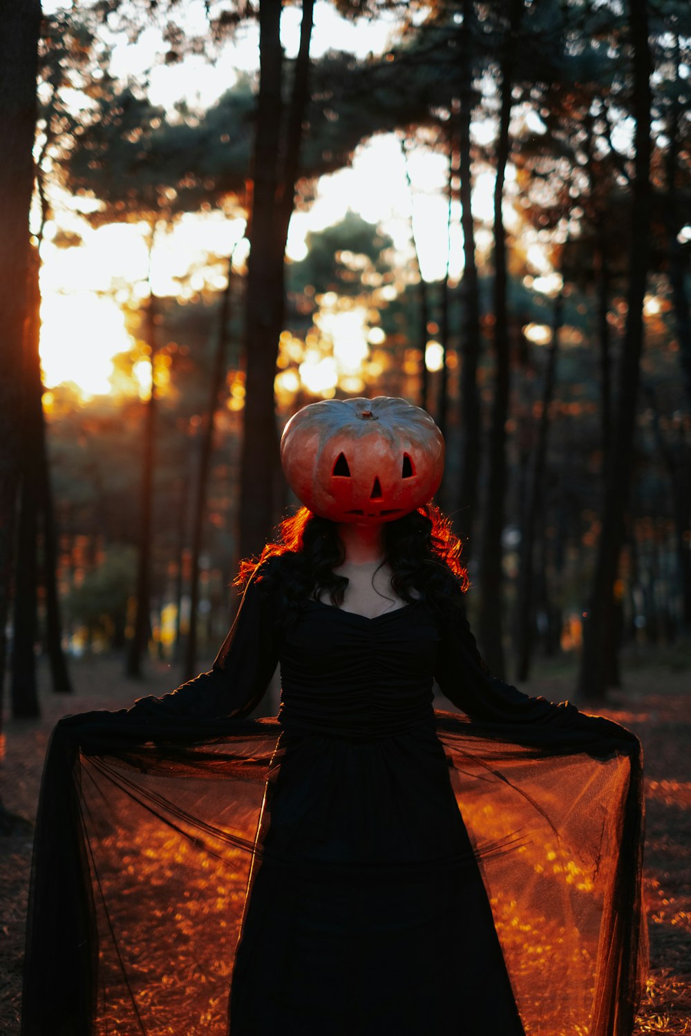 a person wearing a black dress and a red and white mask