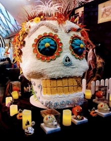 An intricately designed skull centerpiece on a table.