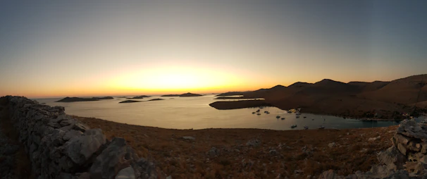 A panoramic view of the Aeolian Islands at sunset, setting the scene for a winter retreat workshop hosted by Sicilian Academies.