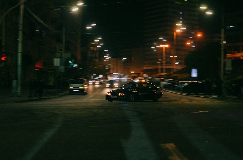 a street with cars on it at night