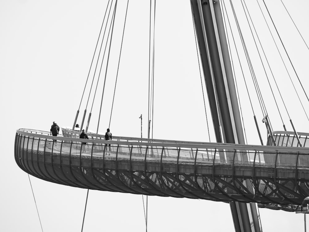a group of people on a bridge