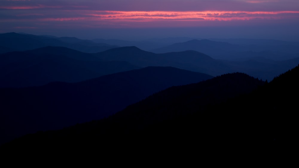 a view of the mountains and the sky