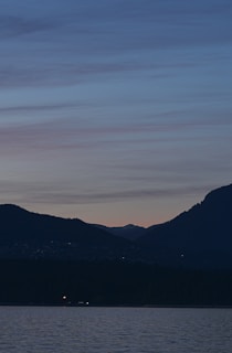 A serene landscape at dusk with soft, muted colors, symbolizing reflection and contemplation.