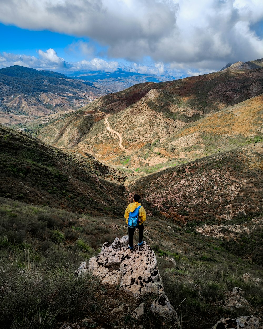 a person standing on a rock