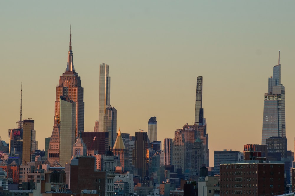 a city skyline with tall buildings