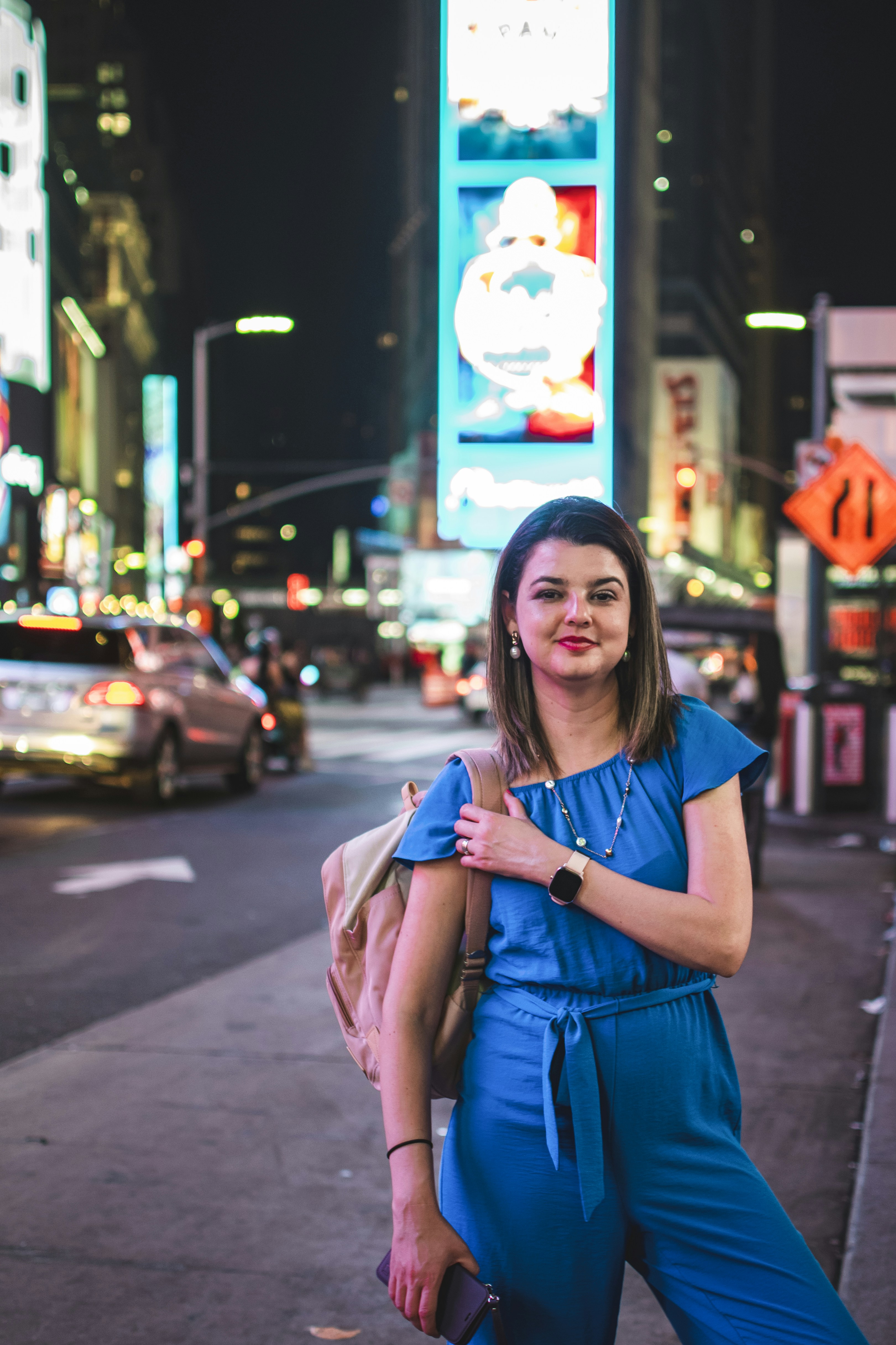 A woman in a blue dress on a street at night photo – Free Girl Image on ...