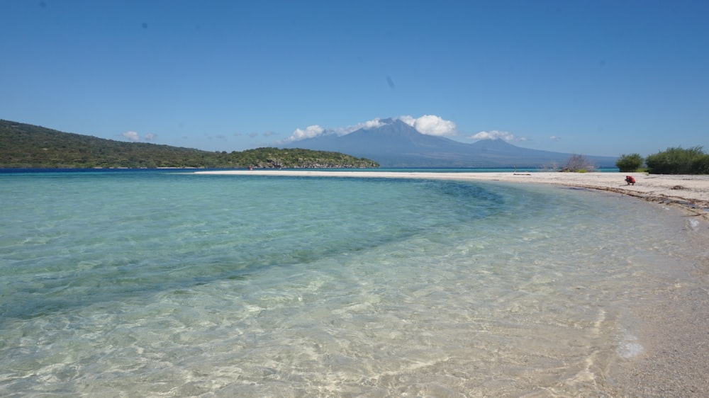 a beach with clear blue water