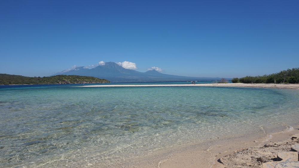 a beach with clear blue water